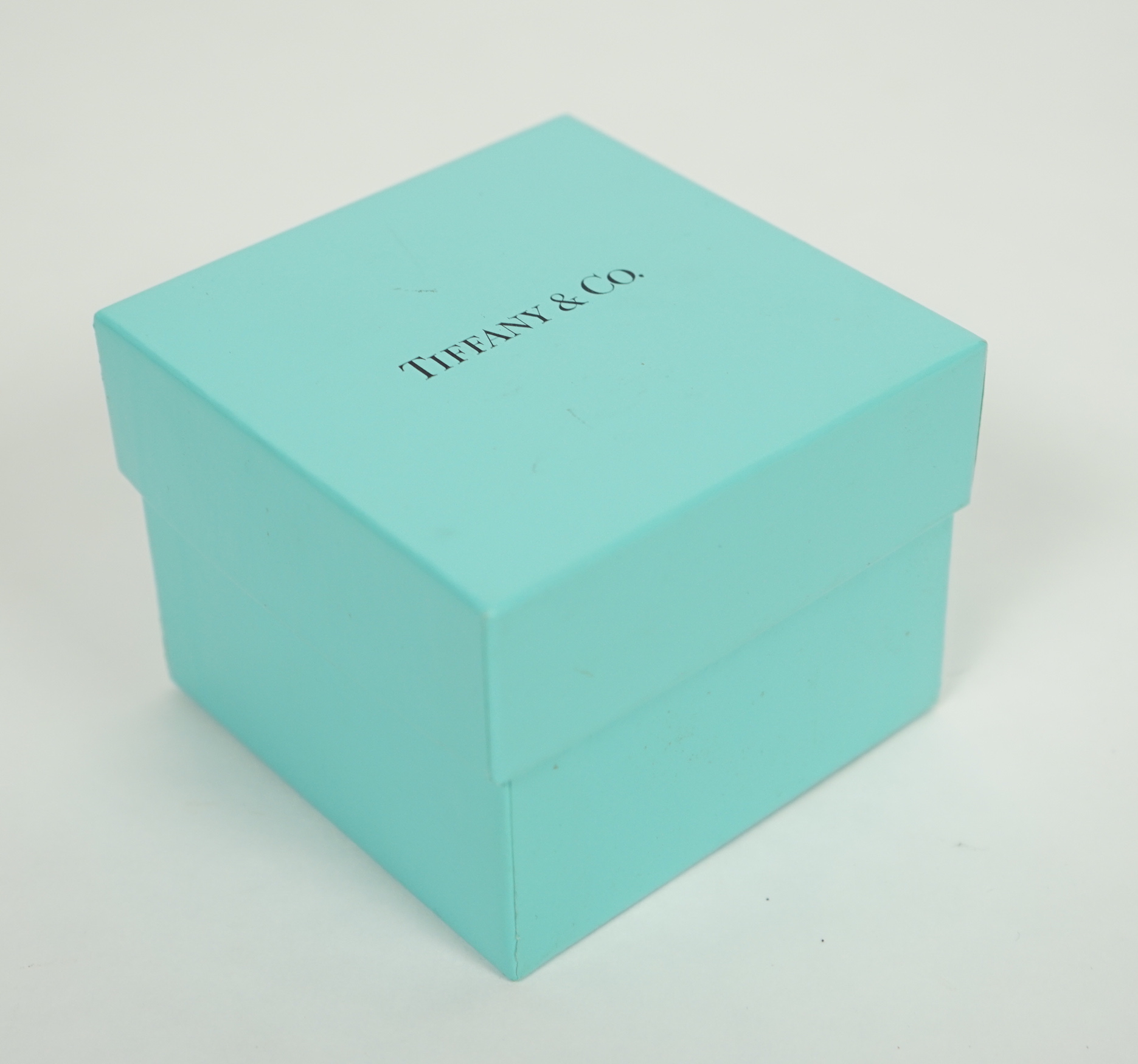 A modern Tiffany & Co sterling 925 christening mug, numbered 23245, height 6cm, 3.4oz, with Tiffany & Co box.